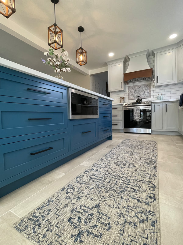 Kitchen remodel with blue island cabinetry