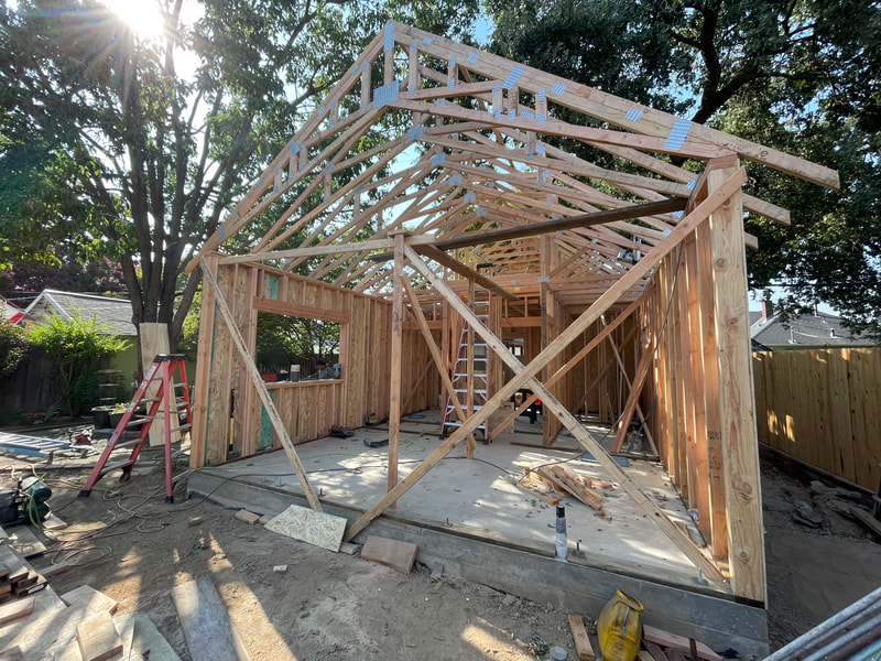 DLM Builders Instagram post — ADU roof framing